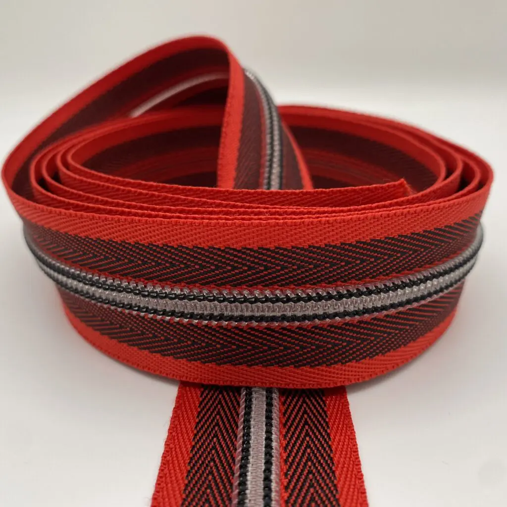 Reißverschluss Herringbone rot-transparent